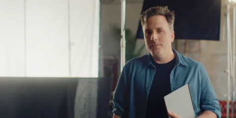 A creative holding his reMarkable Paper Pure.