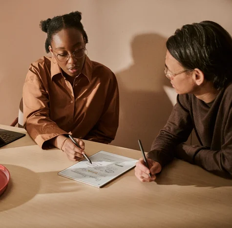 Two people in a meeting using a reMarkable Paper Pro