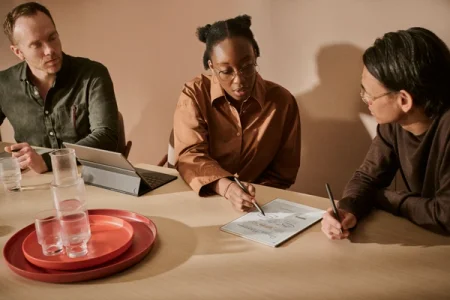 A reMarkable paper tablet showing notes while someone is writing with the Marker during a meeting.