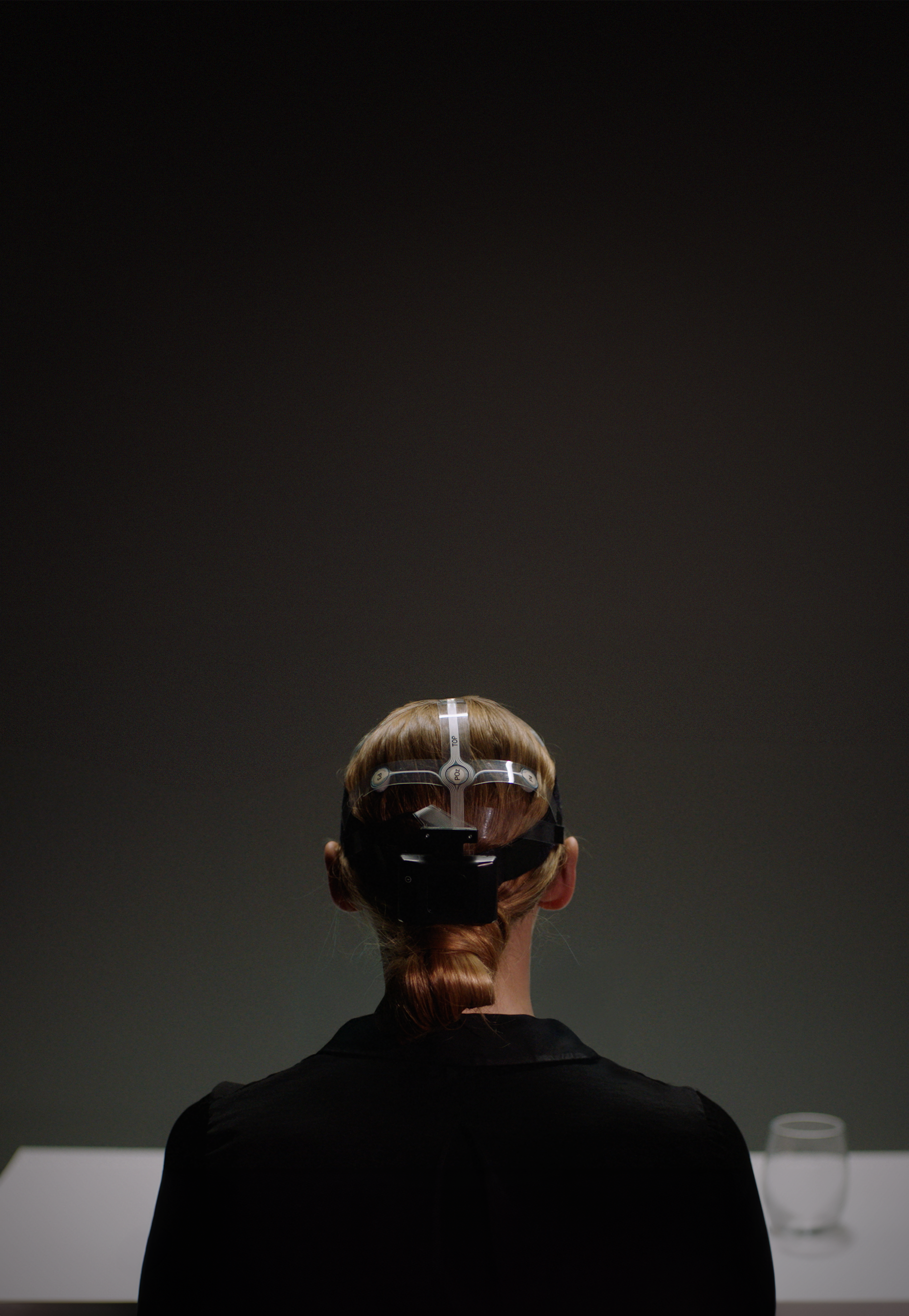 Neuron testing with specialised equipment attached to a woman's head.
