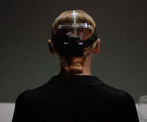 Neuron testing with specialised equipment attached to a woman's head.