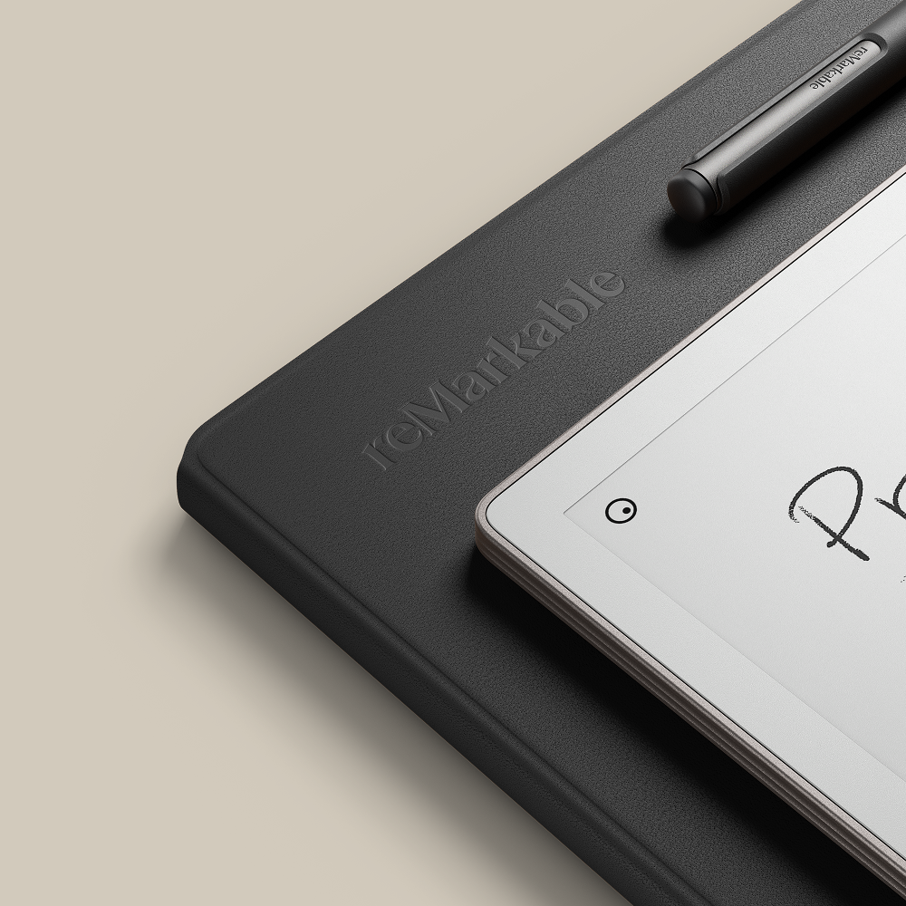 Close up of a reMarkable Paper Pro, a Leather folio in black color, and a Marker Plus