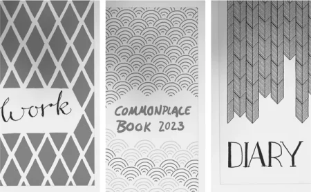 Three journals: "Work", "Commonplace Book 2023", and "Diary".