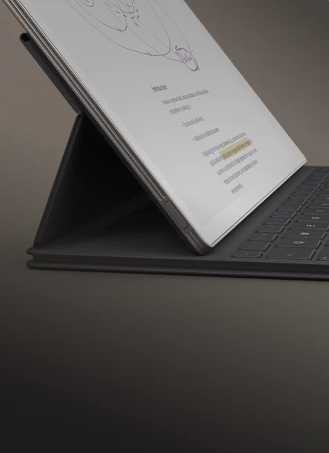 Displaying reMarkable Paper Pro tablet with Type Folio from the side showcasing how the tablet stands upright at an angle with the Type Folio cover.
