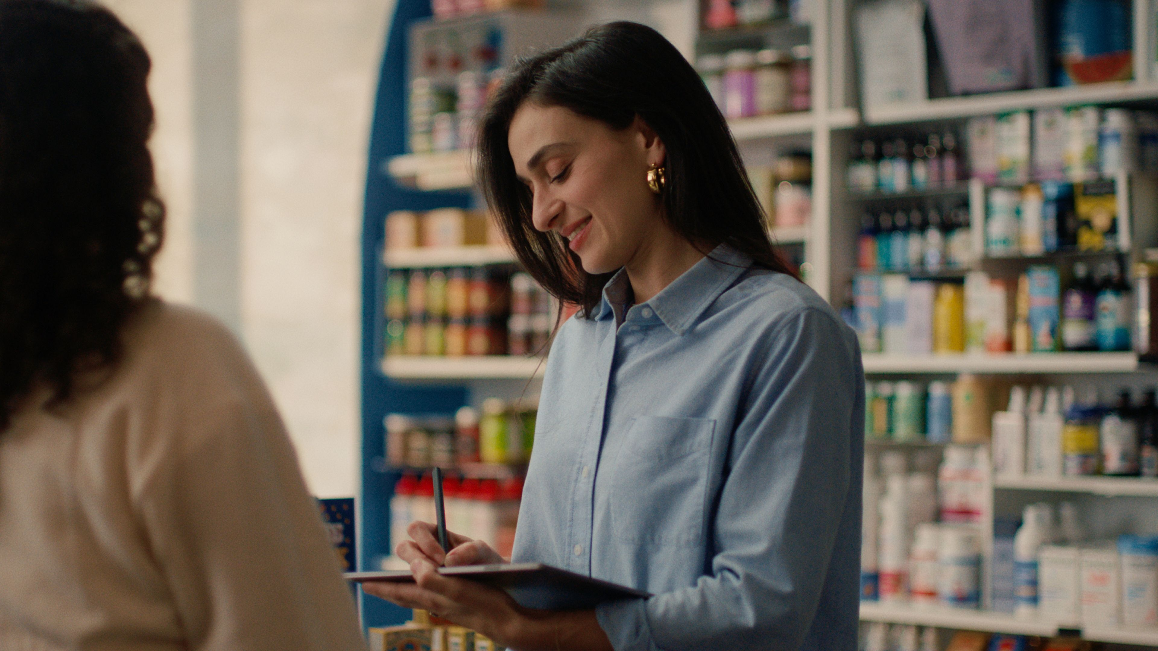 A reMarkable paper tablet being used to take notes with the Marker in a shop