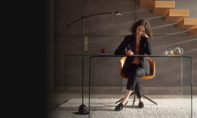 Woman sitting with reMarkable tablet