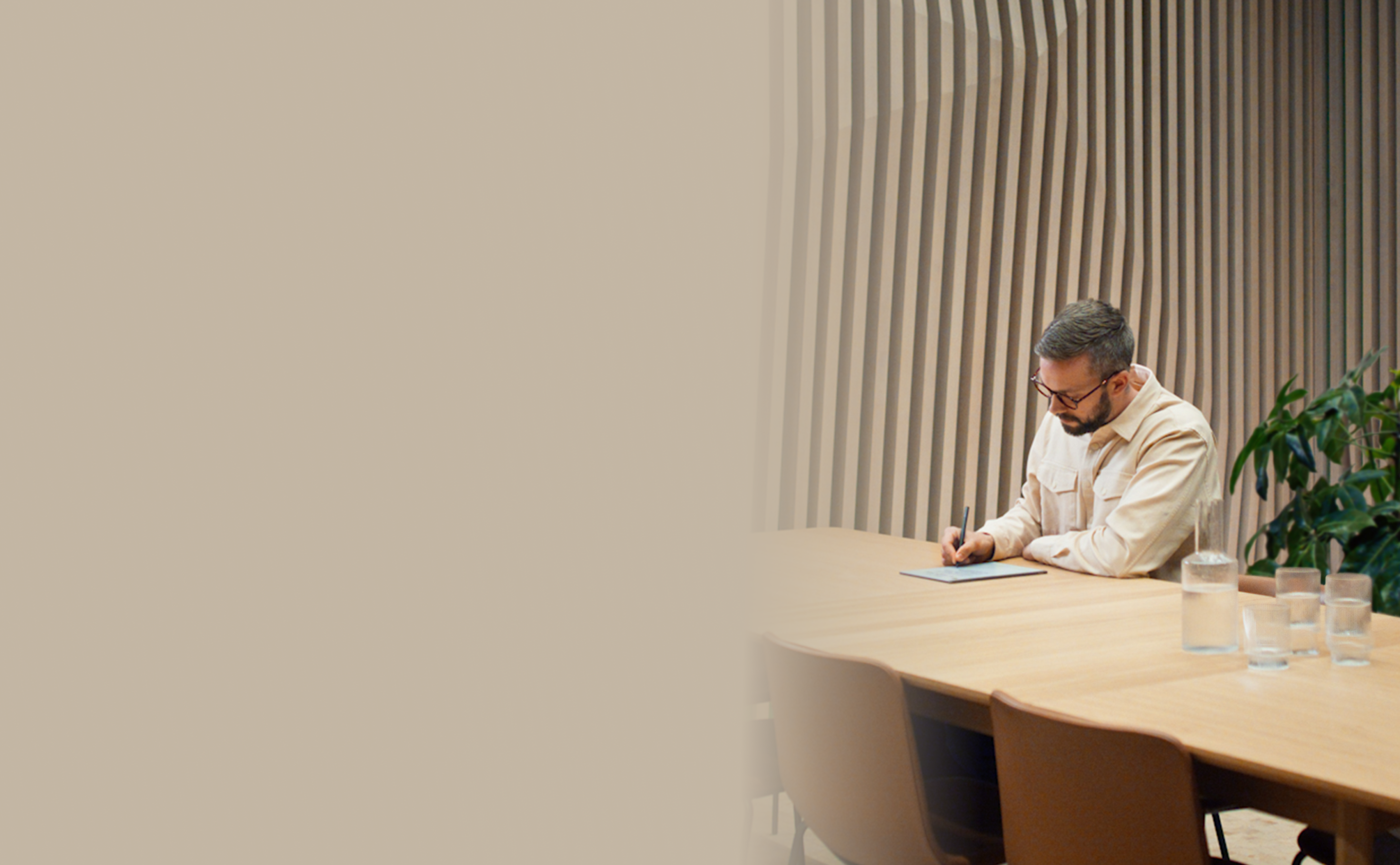 Man writing on reMarkable 2