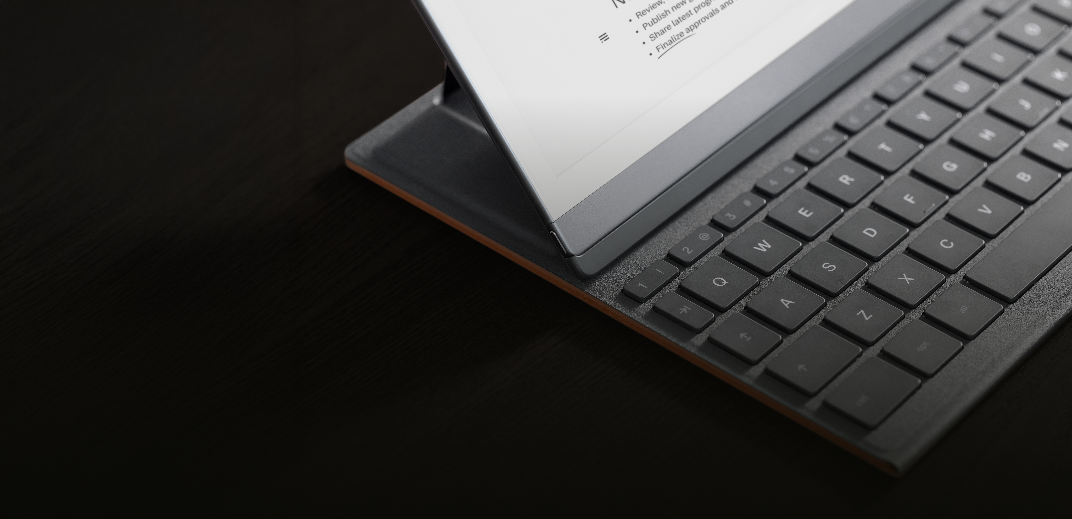 A reMarkable paper tablet attached to a Type Folio.
