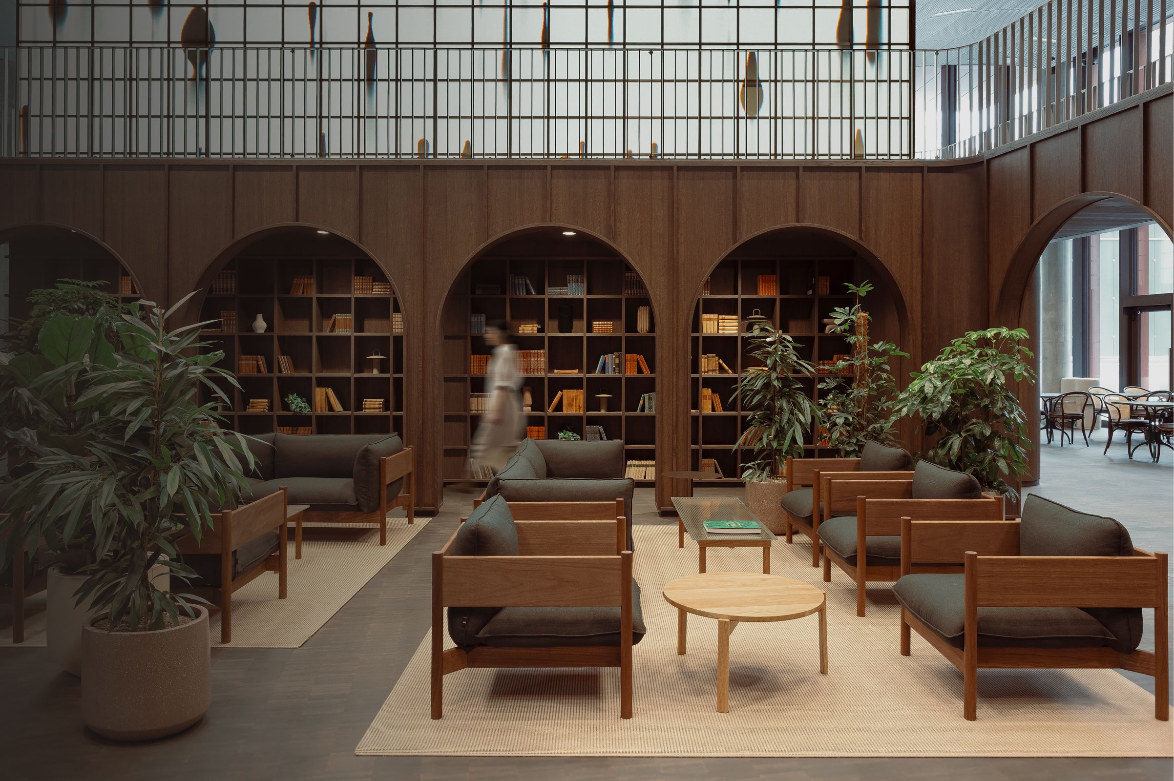Indoor library lounge area with brown furniture in the reMarkable Oslo office.
