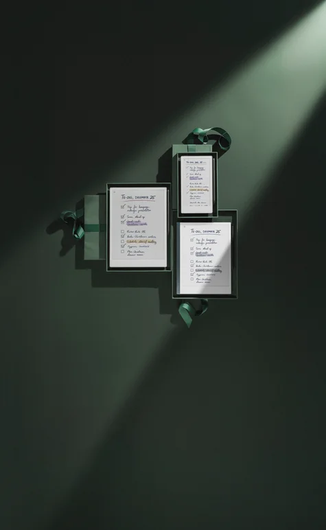 reMarkable Paper Pro, reMarkable Paper Pro Move and reMarkable 2 all gift wrapped in dark green paper, displaying TO DO lists for December 25th .