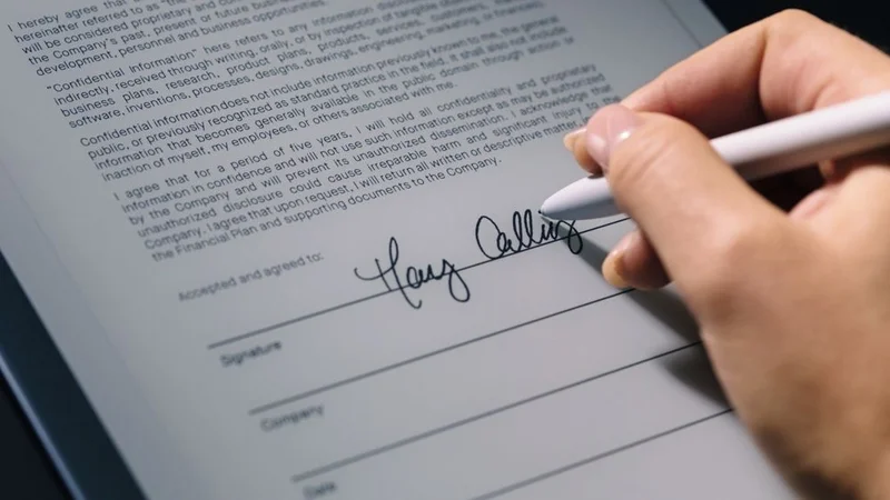 Signing a document on a reMarkable paper tablet with the Marker.