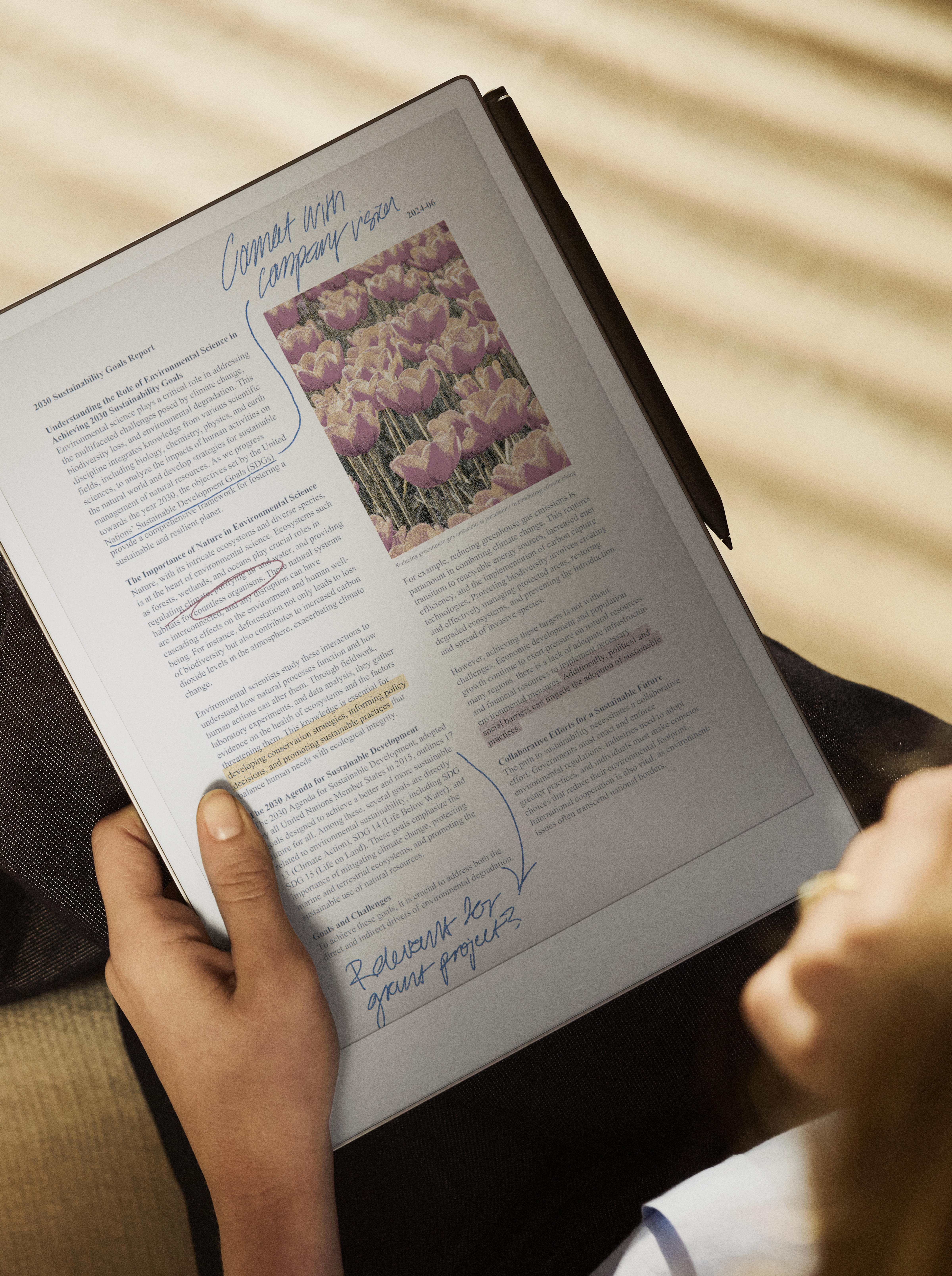 Person sitting down holding reMarkable Paper Pro in their lap