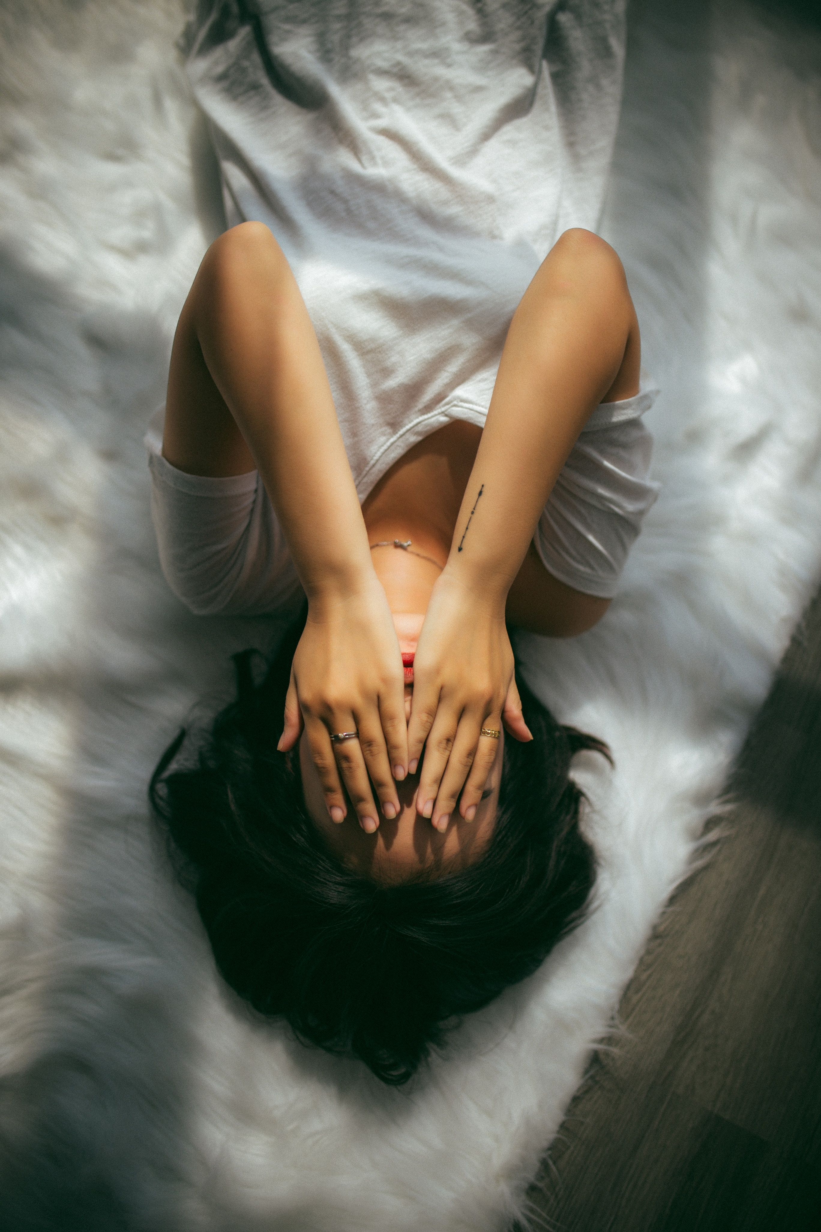 Sad woman covering her face