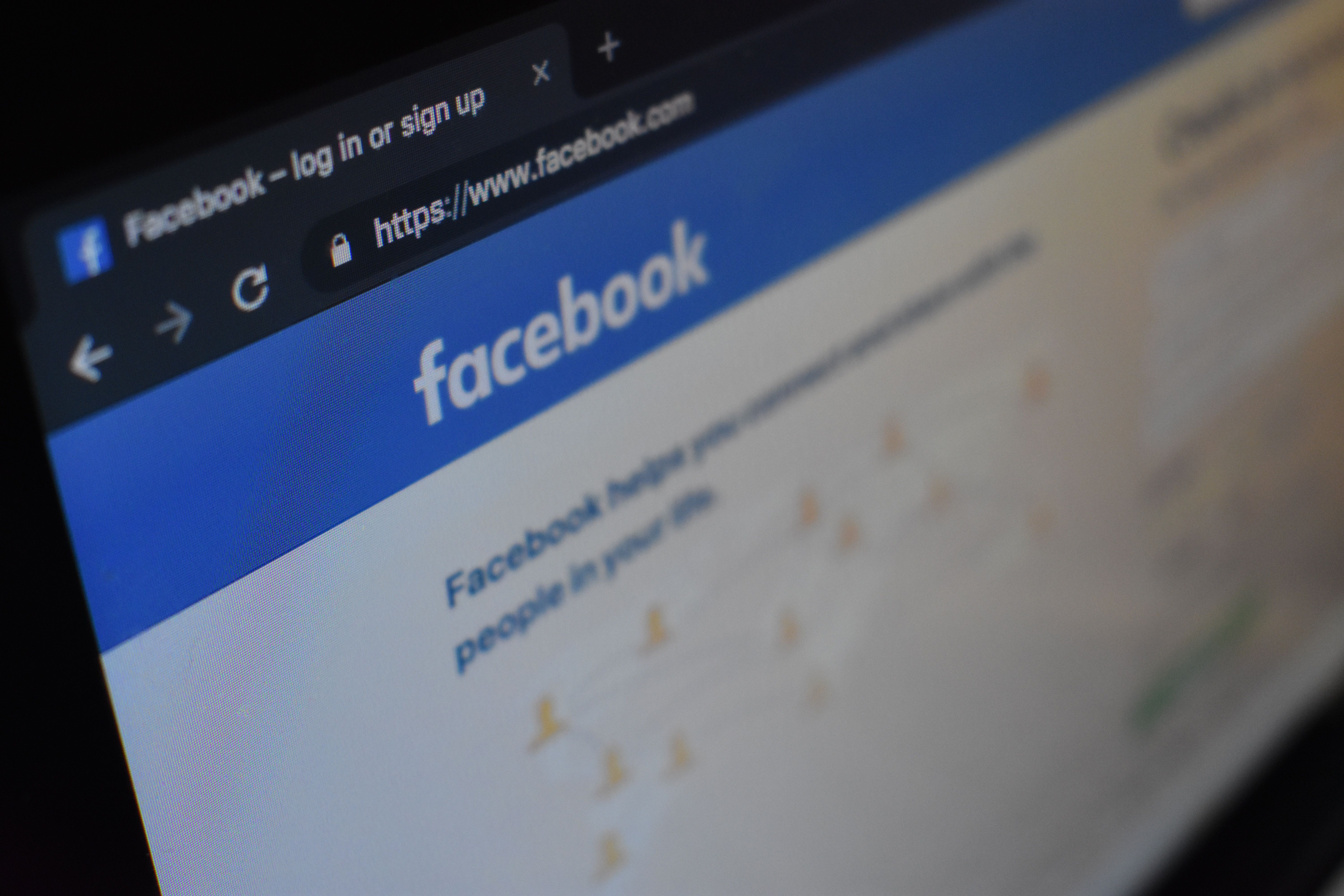 Phone screen with Facebook home page