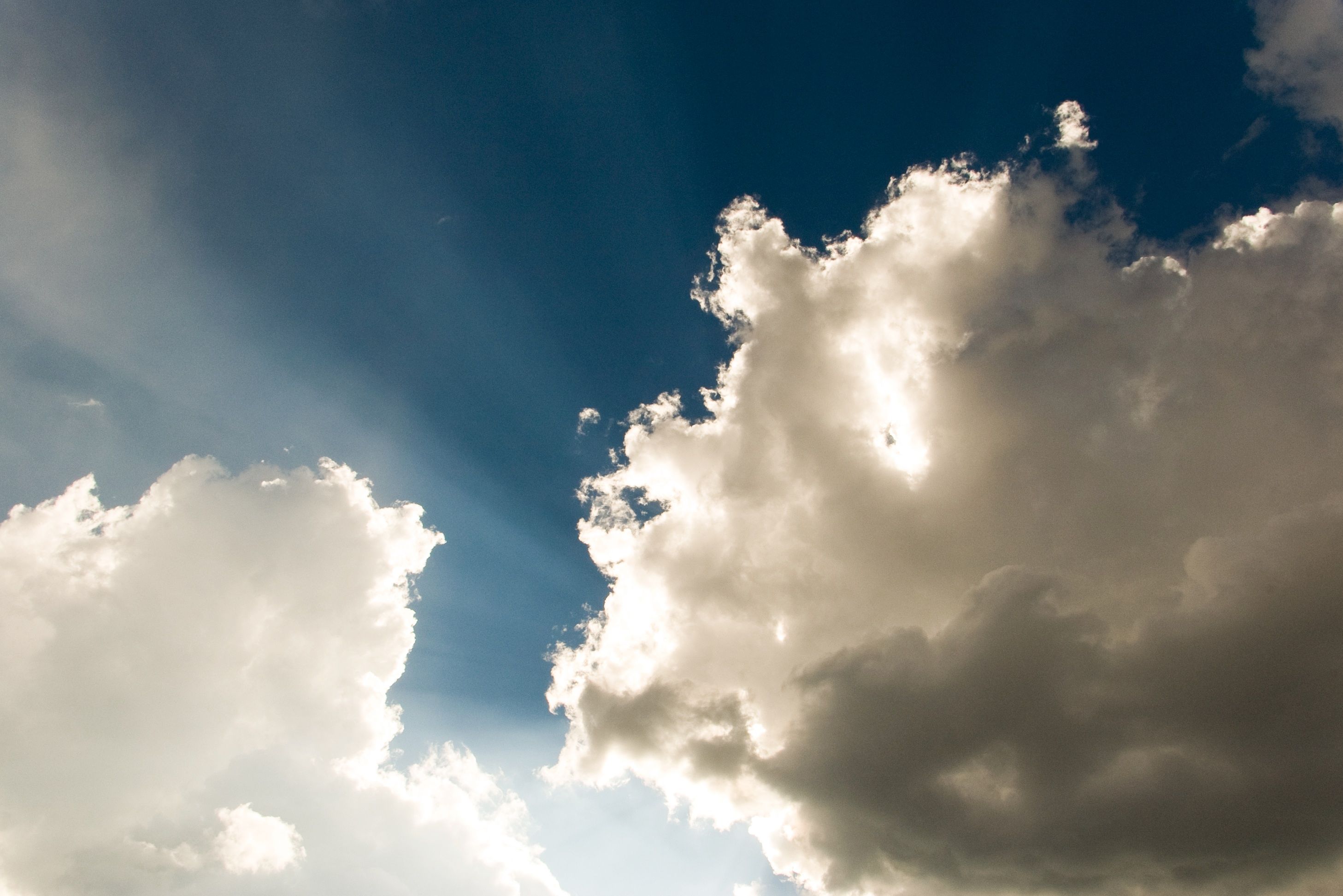 Image of the sun shining through clouds