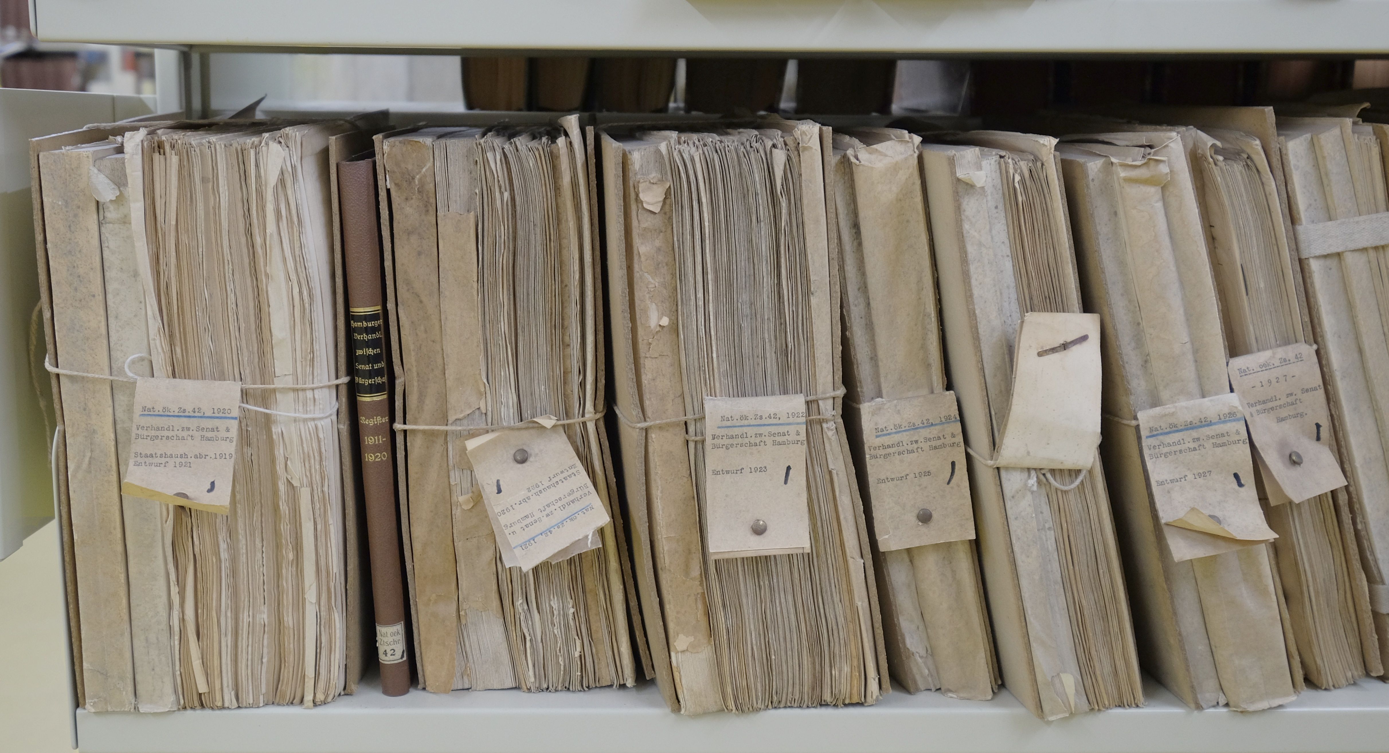 Old papers bound with string and labeled