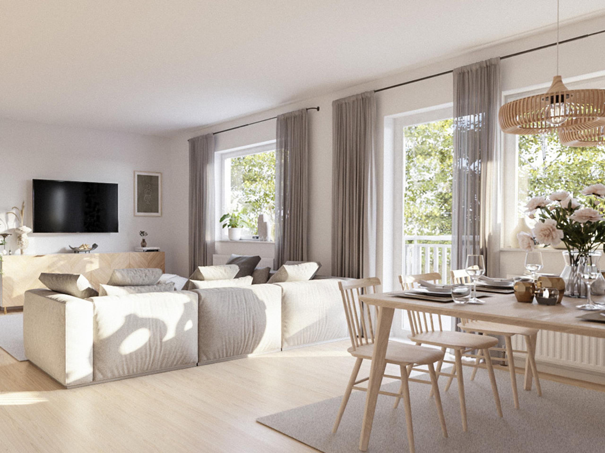 living room furnished with a sofa and a flat-screen TV.
