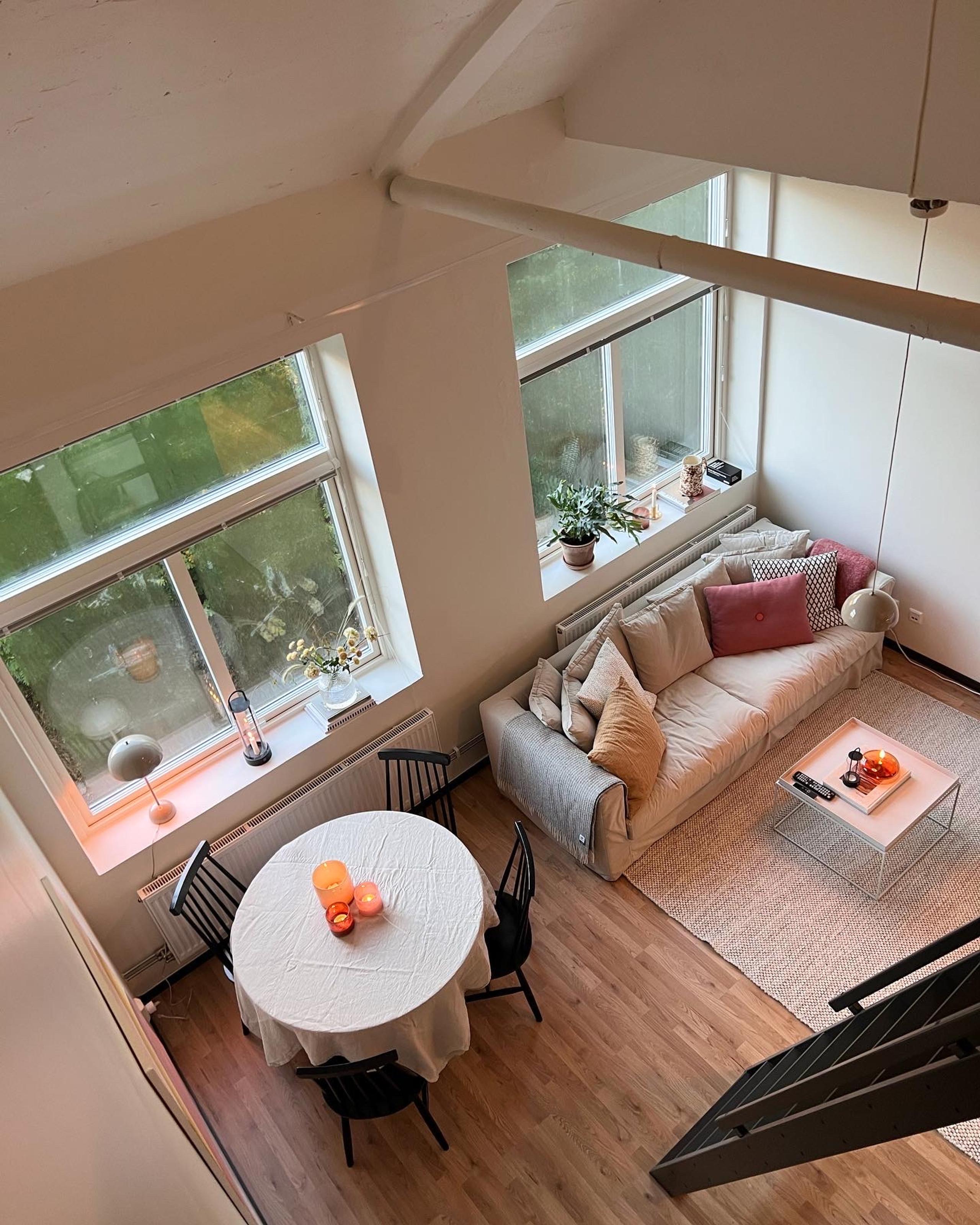 view of a living room and a dining room from above.