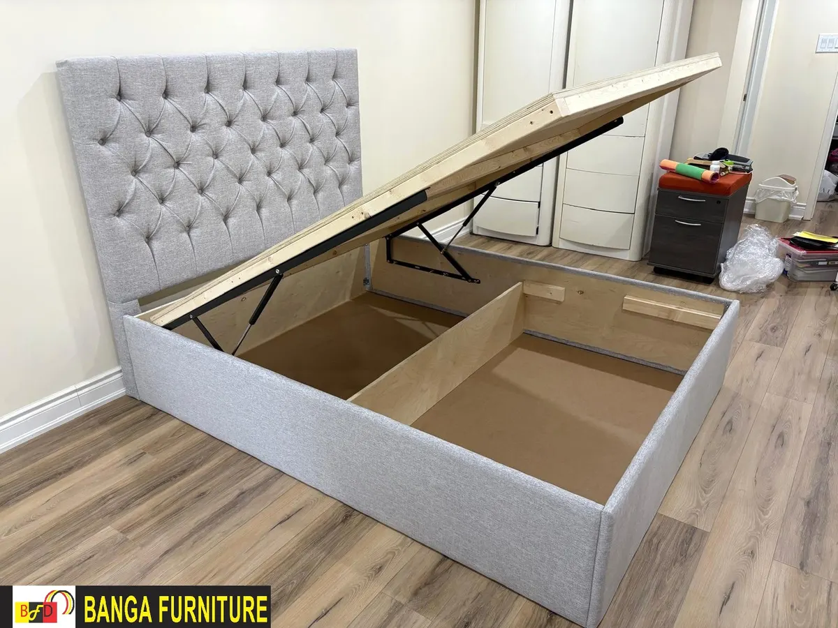 Lift-up storage bed with hydraulic pistons — mattress platform raised