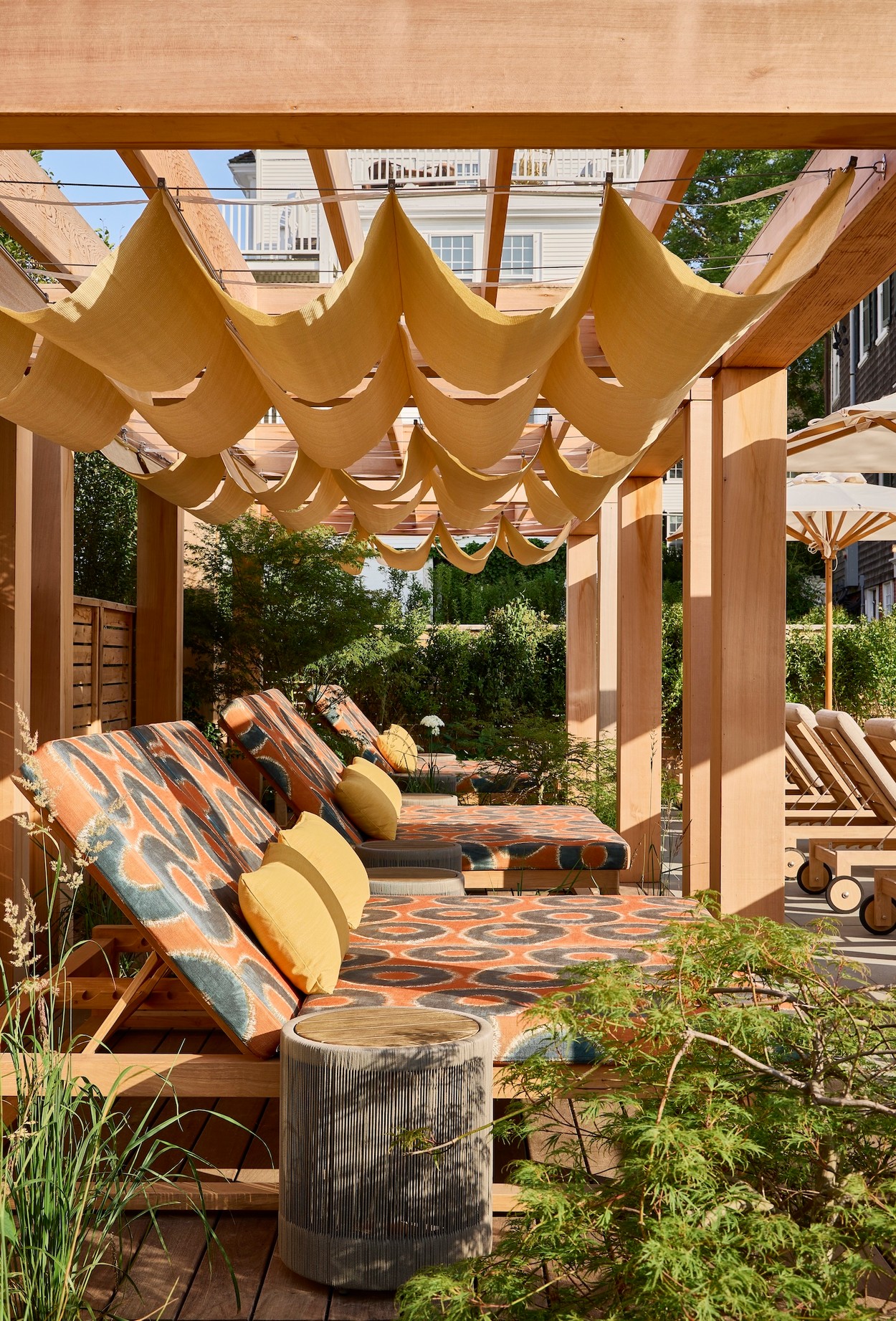 Miroslava-Land-and-Design-Nantucket-Landscape-Architecture-Faraway-Martha's-Vineyard-Outdoor-Lounge-Area-With-Patterned-Chaise-Lounges