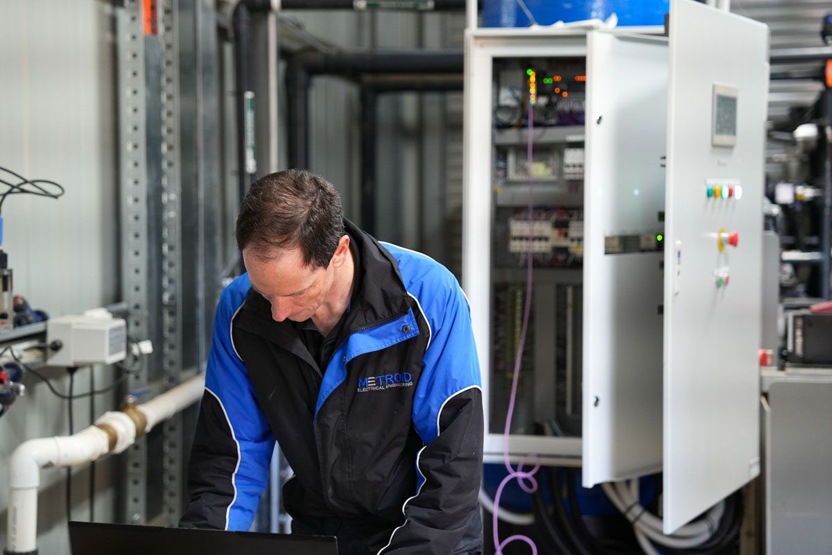 Metroid engineer commissioning a switchboard on site