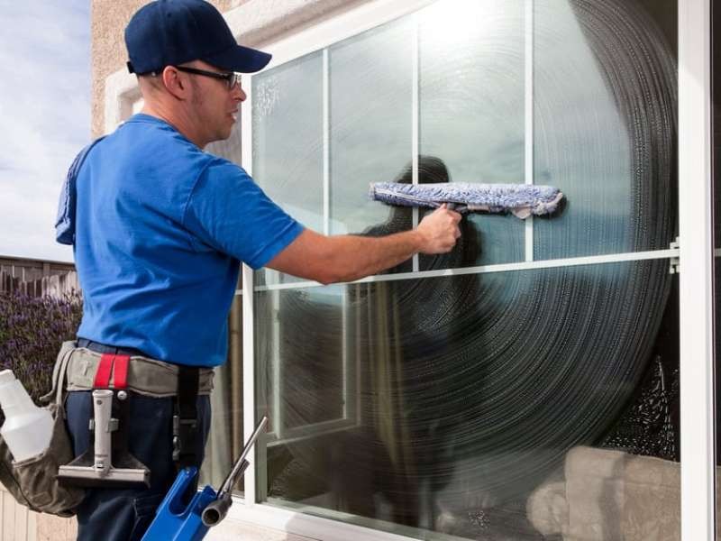 Commercial window cleaning on a tall glass building in Australia
