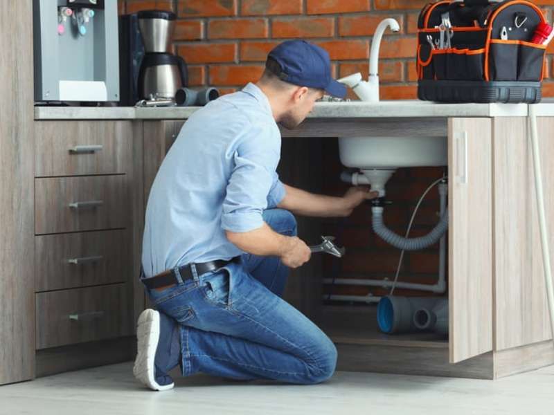 Skilled handyman repairing a house interior with professional tools