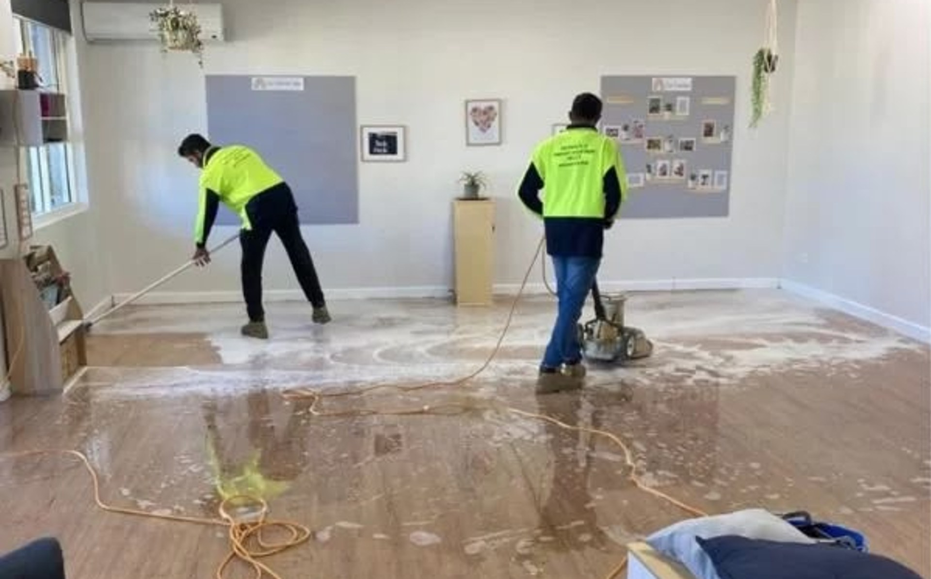 Keen Cleaning team maintaining a commercial timber floor