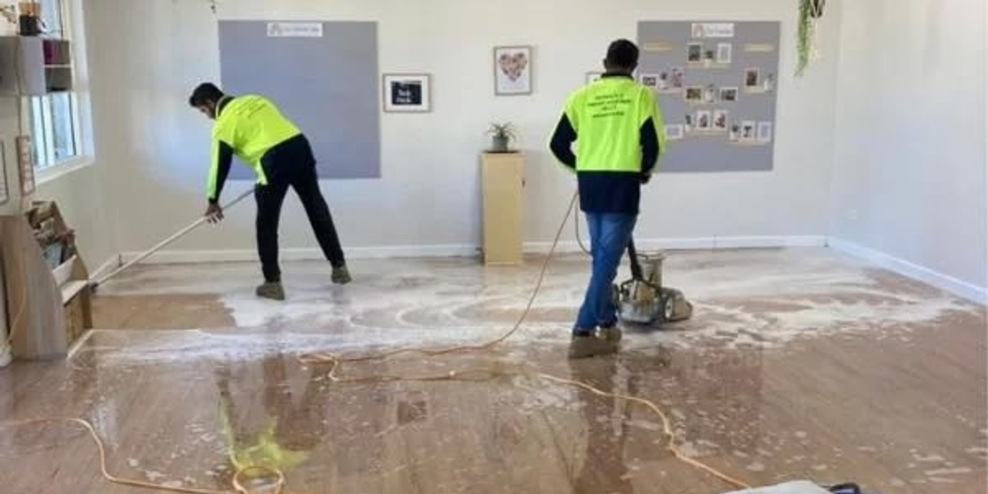 Commercial cleaning team on a workplace floor