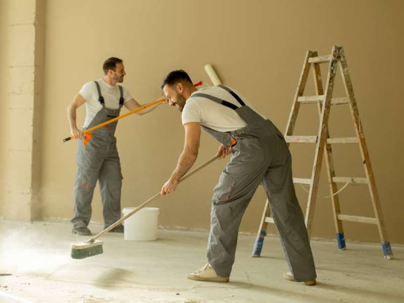 Industrial builders cleaning team at work