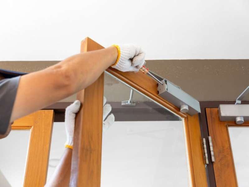 Carpenter at work with hammer and chisel