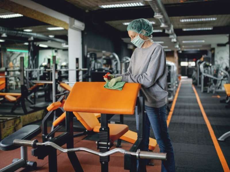 Professional Melbourne cleaner at work in office