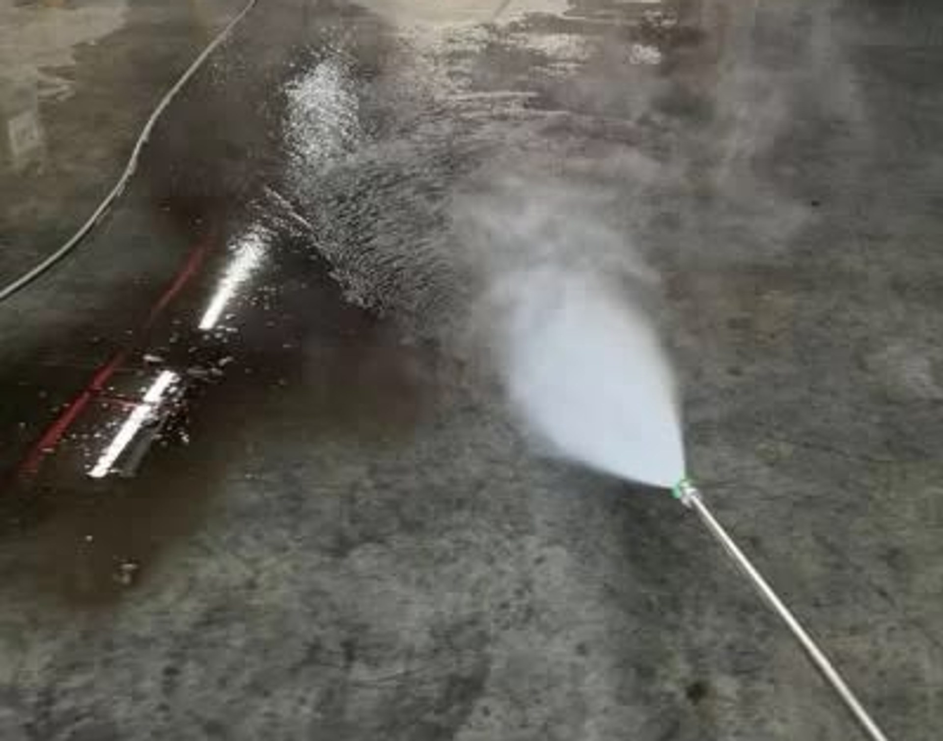 Pressure washing a commercial car park floor