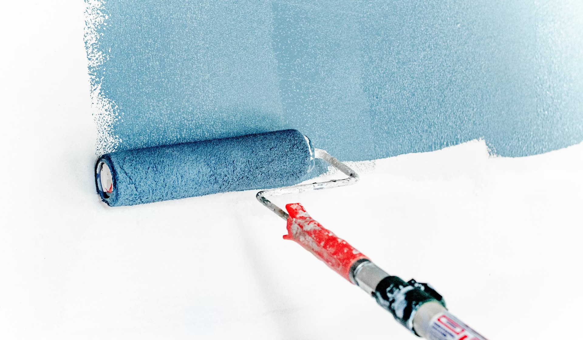 Professional painter painting interior wall — Keen Cleaning Australia
