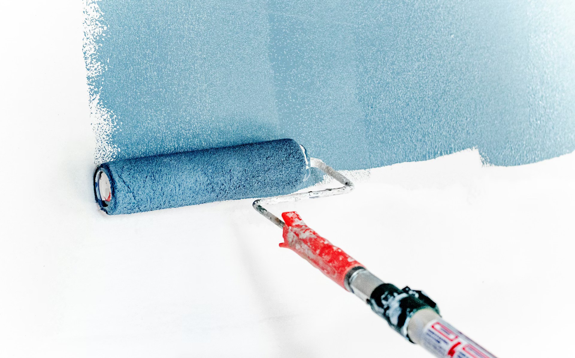 Professional painter painting interior wall — Keen Cleaning Australia