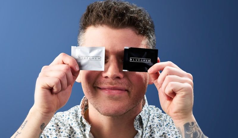 Sildenafil and tadalafil packets with happy man