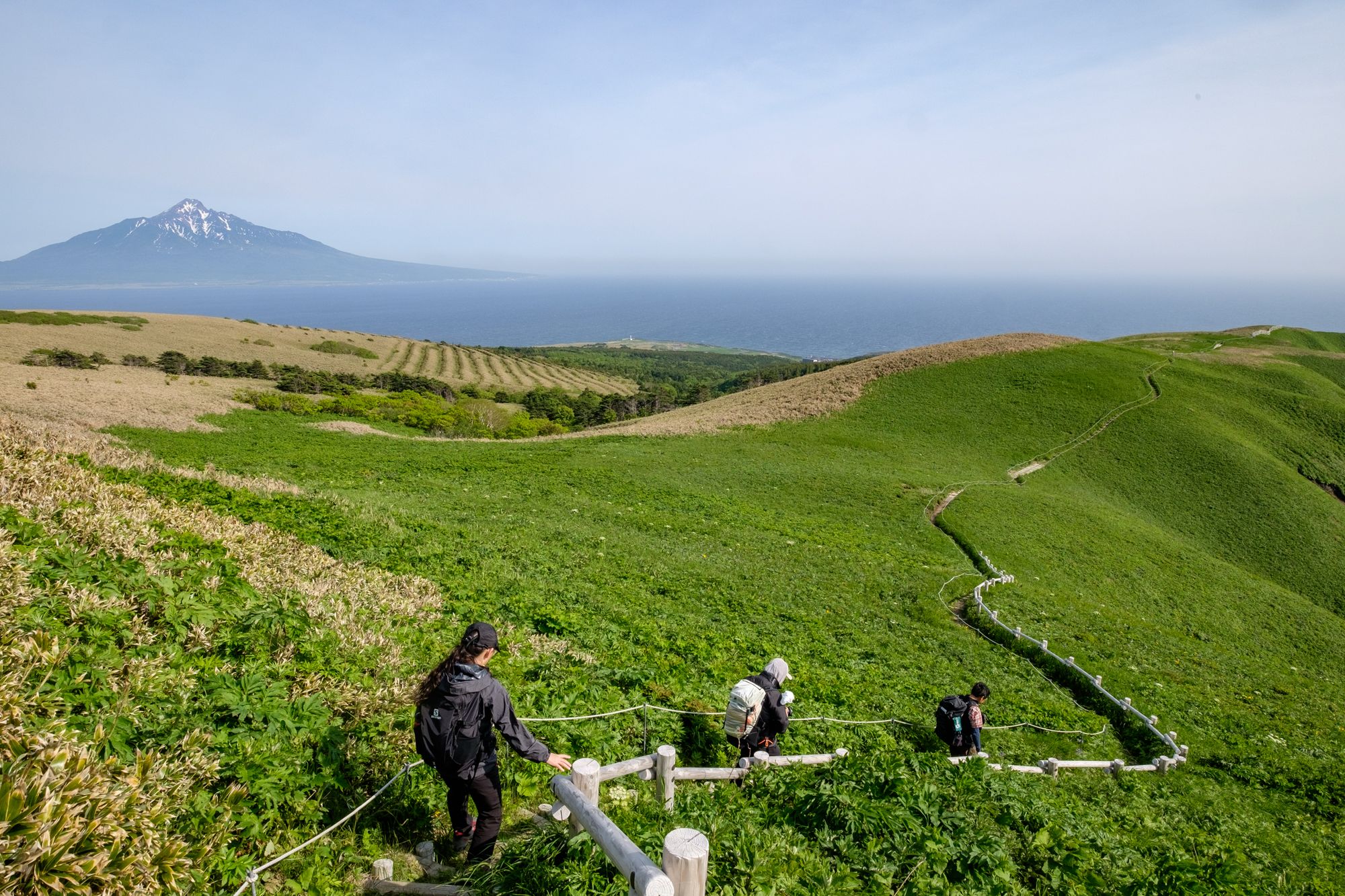 Hikers walking along a trail on Rebun island