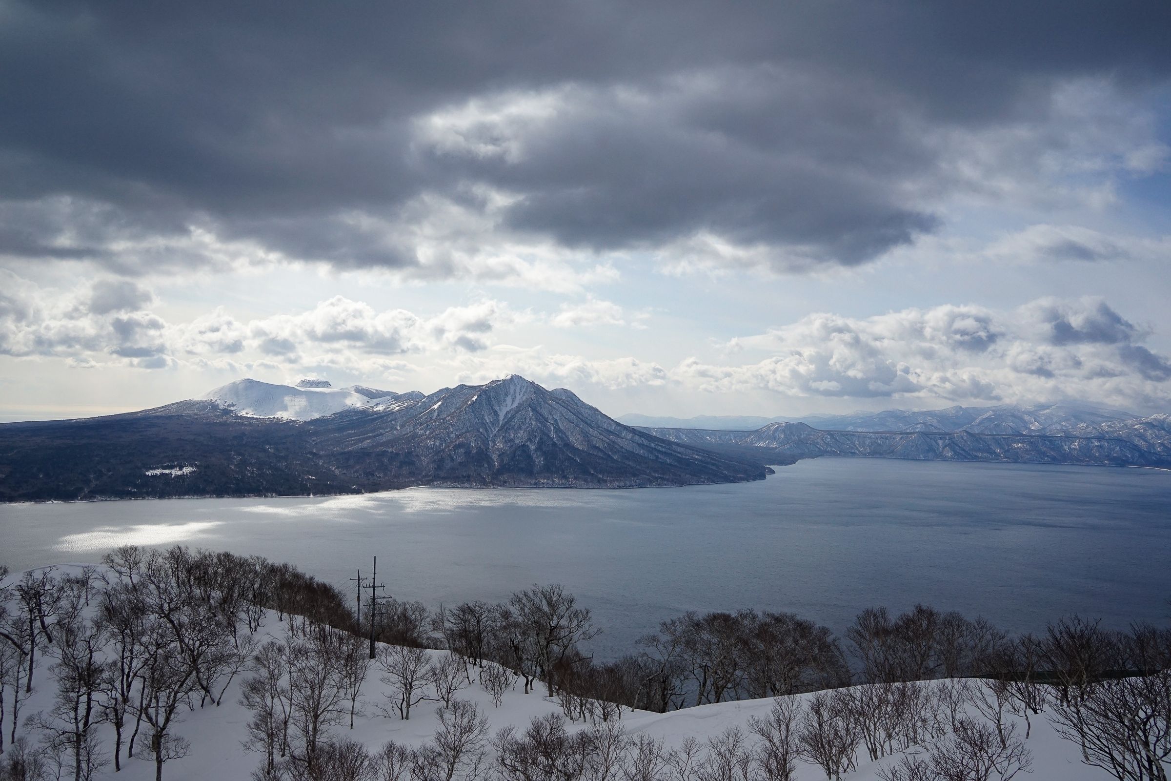 Lake Shikotsu, Mt. Fuppushi & Mt. Tarumae viewed from Mt. Monbetsu in winter.