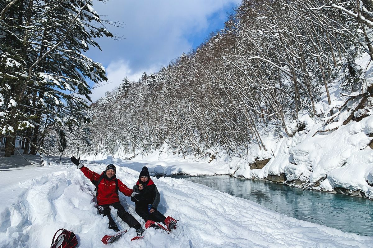 Snowshoe hikers at the Biei Blue River in Hokkaido