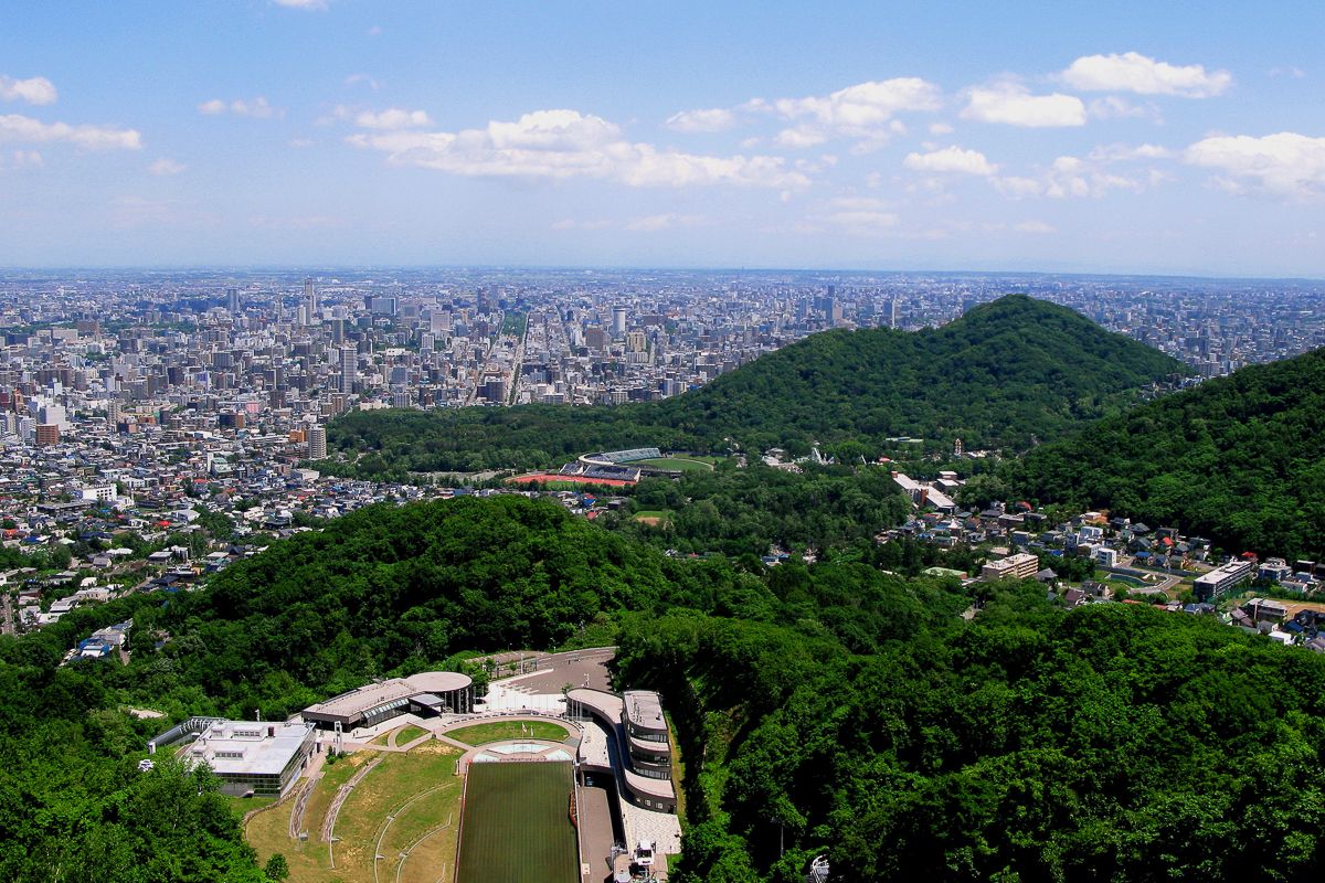 Views of Sapporo city and the Olympic ski jump hill at Mt Okurayama hiking trail in Hokkaido