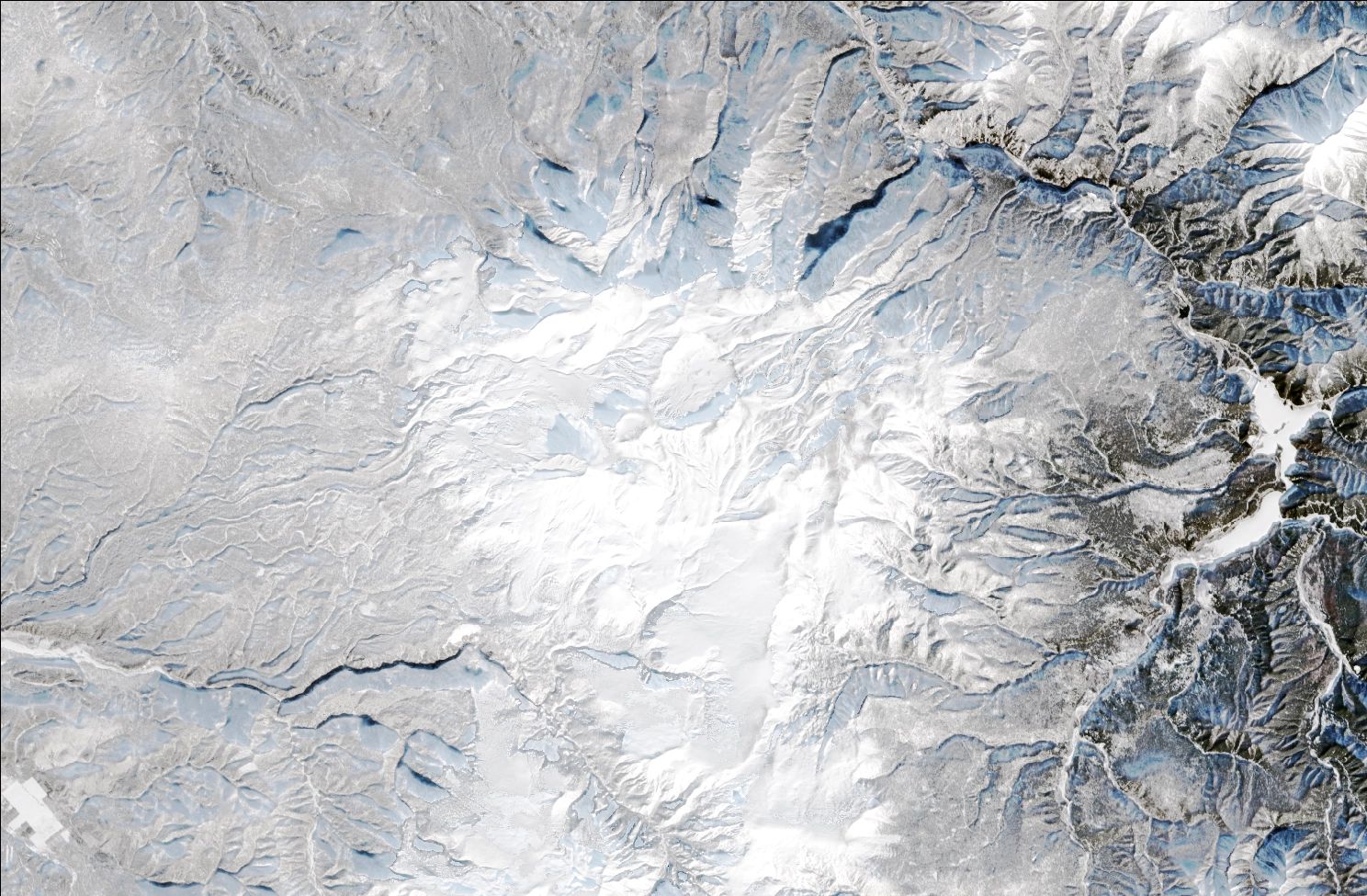 A satellite image showing snow over the northern Daisetsuzan mountains. The landscape is blanketed in white snow.