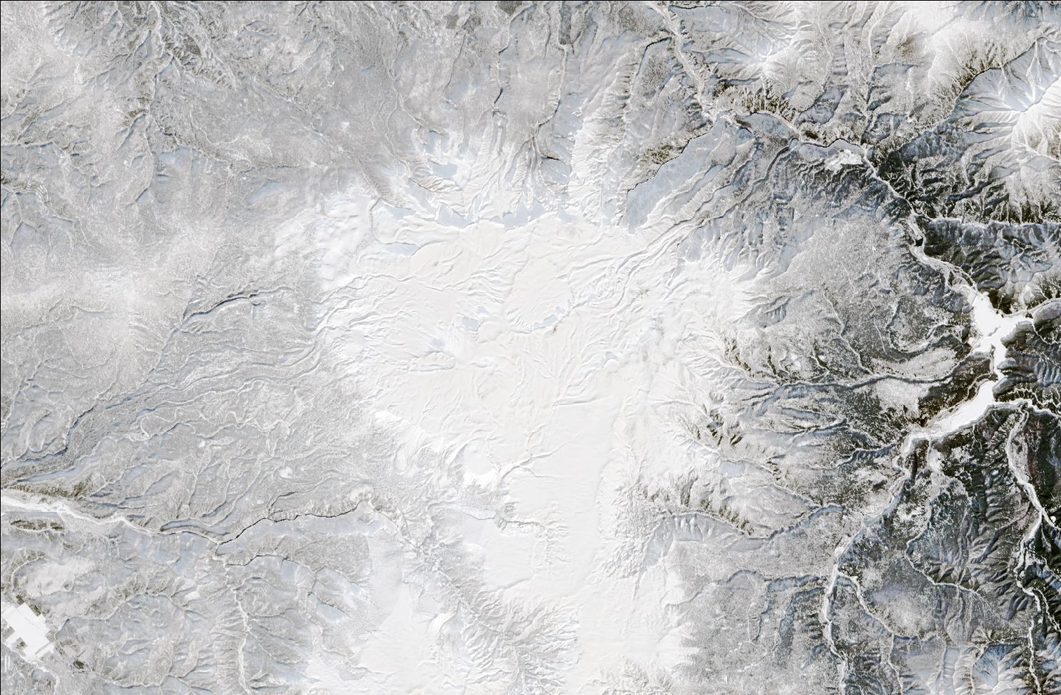 A satellite image showing snow over the northern Daisetsuzan mountains. The landscape is blanketed in white snow.