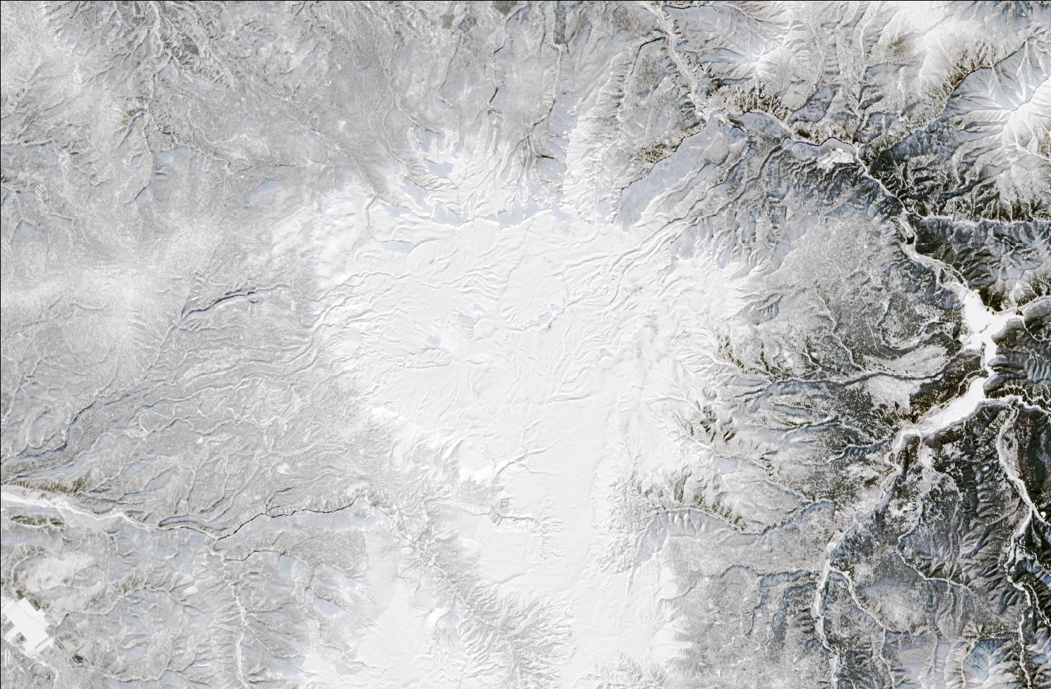 A satellite image showing snow over the northern Daisetsuzan mountains. The landscape is blanketed in white snow.