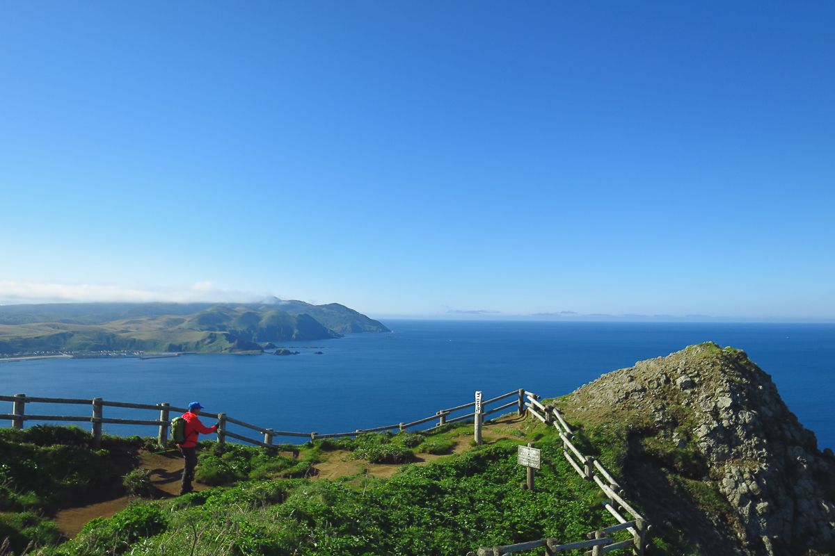 Lone hiker on a headland on Rebun Island in Hokkaido - Best places to visit in Hokkaido