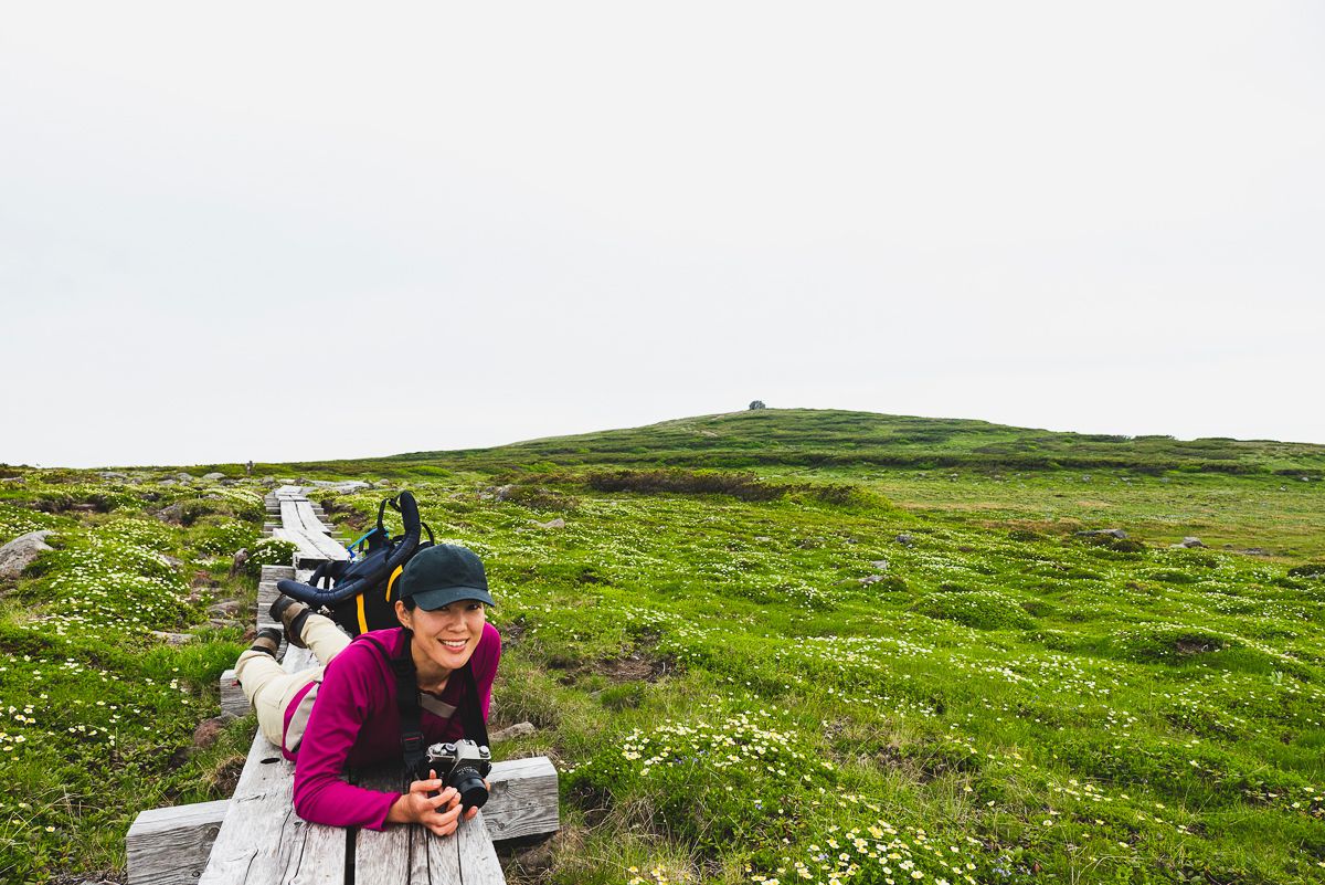 Adventure Hokkaido Guide Ayaka taking photos in spring in Hokkaido