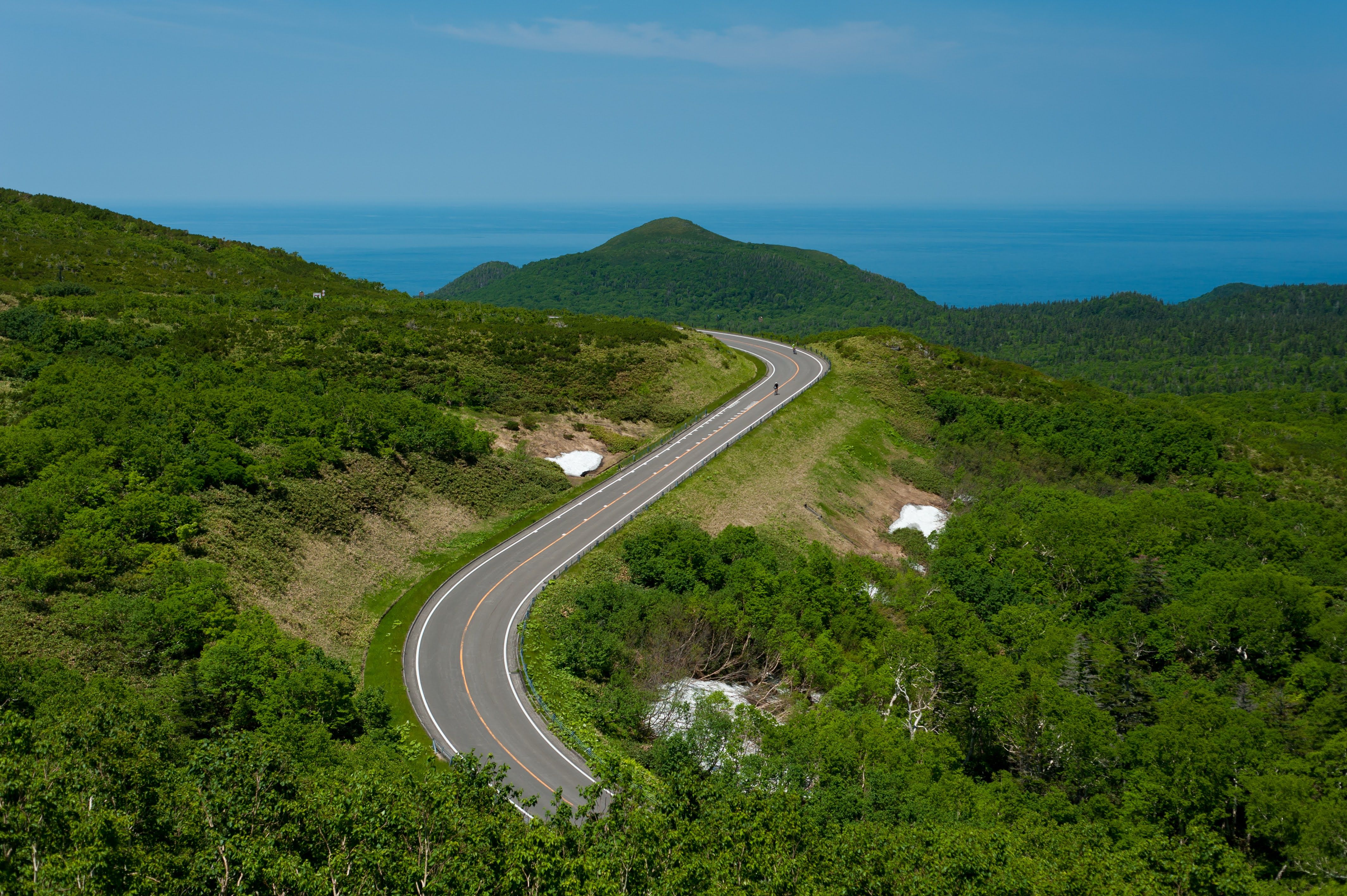 An aerial shot of Shiretoko Pass's winding road.