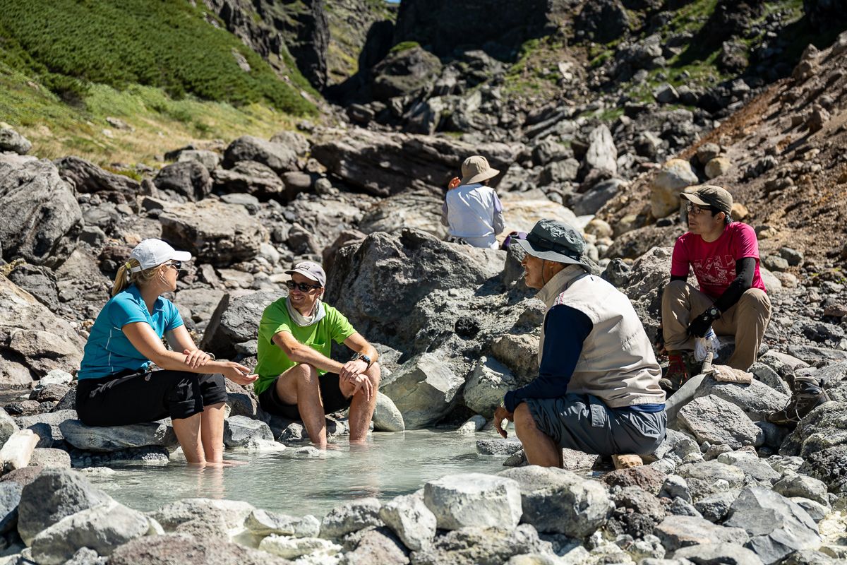 Hikers enjoying the hot springs on the Nakadake Onsen 1 day hike