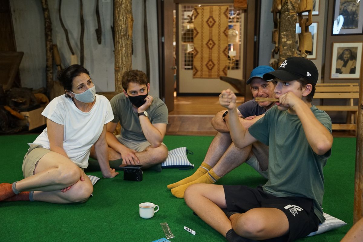 A tourist plays a traditional Ainu mouth harp
