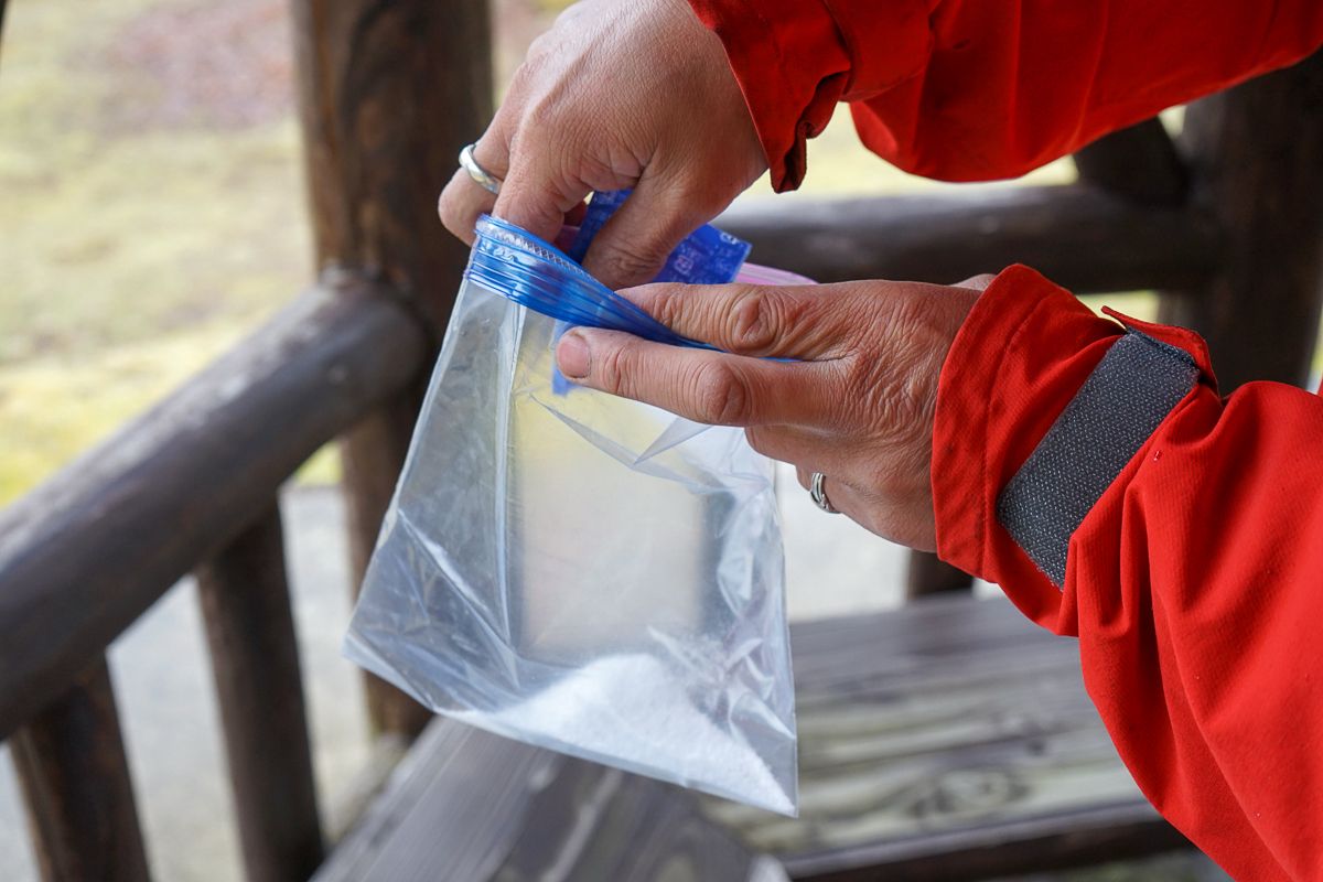 Putting coagulant into a resealable plastig bag