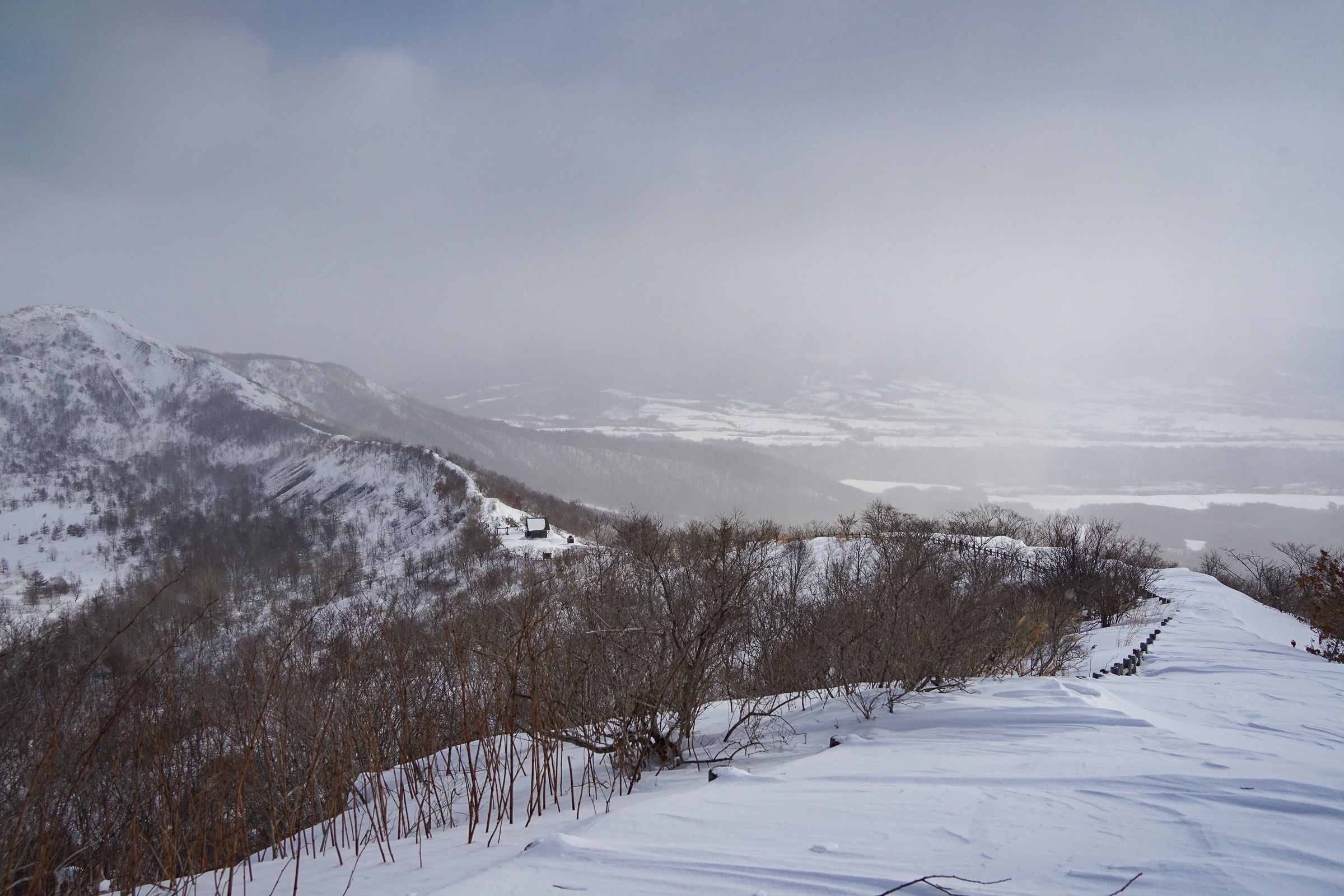 The rim of Mt. Usu crater covered in snow.